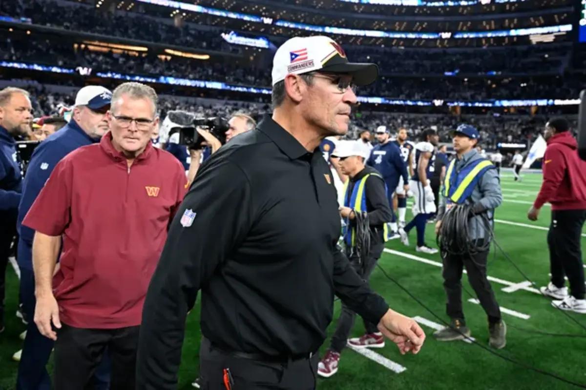 Washington Commanders coach Ron Rivera walks off the field after facing the Dallas Cowboys.